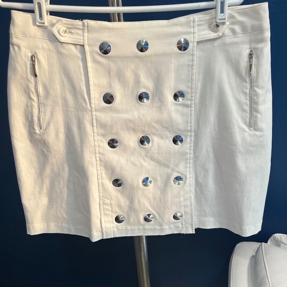 Bright white skort,  lots of bling, pockets.